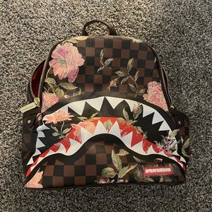 BRAND NEW. SHARKFLOWER SAVAGE BACKPACK (SMALL FIT)